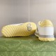 Rear heel view and yellow tread pattern sole of Gucci Mac80 trainer in white and grey