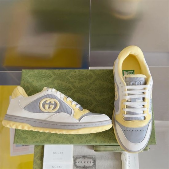 Pair of Gucci Mac80 trainers displayed together against a plain backdrop in white and grey