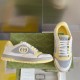 Pair of Gucci Mac80 trainers displayed together against a plain backdrop in white and grey