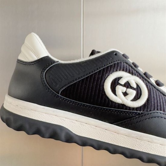 Gucci Mac80 Trainer Logo Detail in black and white Close-up of black fabric panel and embroidered logo on Gucci Mac80 Trainer in black and white