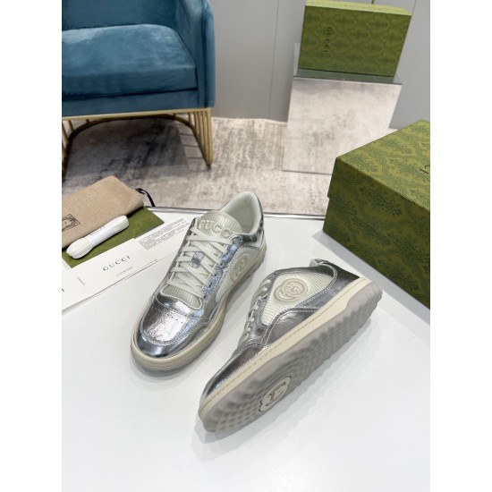 Gucci Mac80 Metallic Silver Trainers Top View in silver and off-white Top-down view of metallic silver Gucci Mac80 trainers with extra laces and packaging in silver and off-white