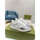 Gucci Mac80 Metallic Silver Trainers Pair on Box in silver and off-white Pair of metallic silver Gucci Mac80 trainers resting on a green patterned shoe box in silver and off-white