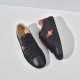 Gucci Men's Ace Bee Embroidered Black Leather Trainers - Top-Down View Top-down view of Gucci Men's Ace Bee Embroidered Black Leather Trainers displaying black eyelets and leather lining