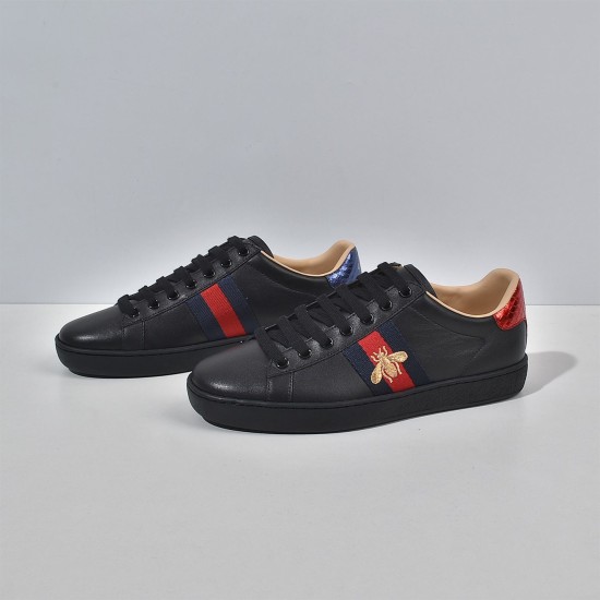 Gucci Men's Ace Bee Embroidered Black Leather Trainers - Perspective View Side profile of Gucci Men's Ace Bee Embroidered Black Leather Trainers on a plain white surface