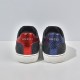Direct rear view of metallic red and blue heels with brand lettering in black