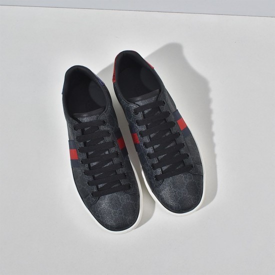 Top-down view of Gucci Ace GG Supreme trainers in black showcasing lace-up closure