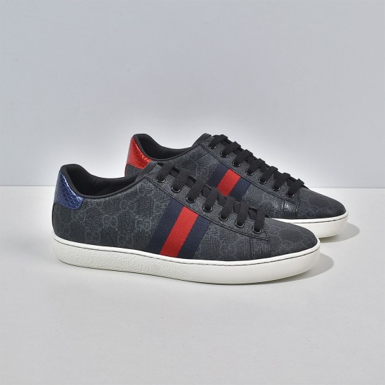 Three-quarter view of black Gucci Ace GG Supreme low-top trainers