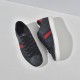 Top and side view of Gucci Ace GG Supreme low-top trainers in black