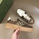 Gucci GG Supreme Brown Trainer Lateral Side View in brown and white Hand holding Gucci GG Supreme brown leather platform trainer highlighting the outer lateral profile in brown and white