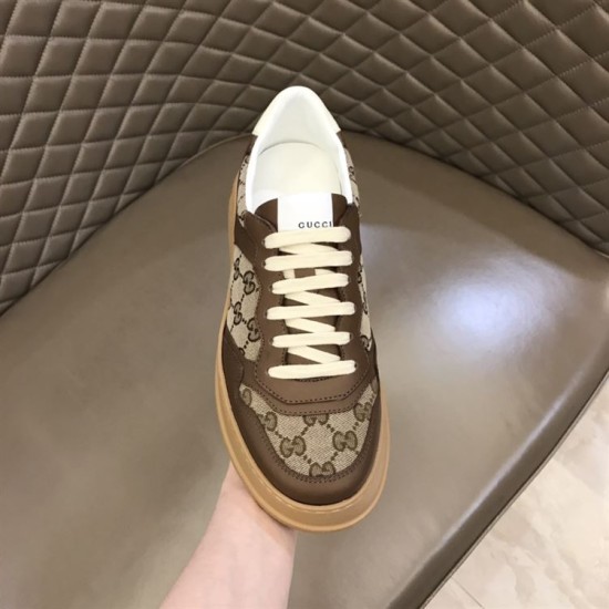Gucci GG Supreme Brown Trainer Toe and Tongue View in brown and white Front upper perspective view of Gucci GG Supreme brown platform trainer held in hand in brown and white