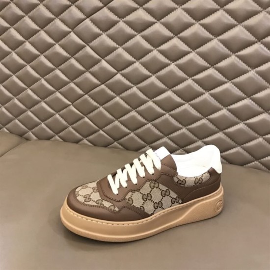 Gucci GG Supreme Brown Trainer Single View in brown and white Single Gucci GG Supreme brown leather trainer resting on a plush padded bench in brown and white