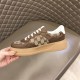 Gucci GG Supreme Brown Trainer Medial Side View in brown and white Hand holding Gucci GG Supreme canvas brown leather trainer showing inner medial side in brown and white