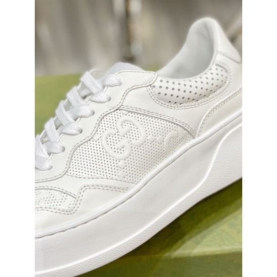 Gucci White Leather Texture Detail Detailed close-up of perforated leather panels and embossed GG motif in white