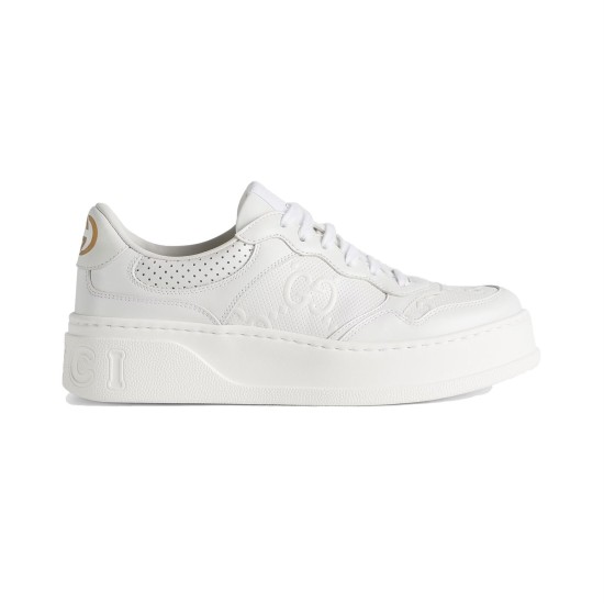 Gucci White Embossed Leather Trainer Profile Profile view of Gucci white embossed leather platform low top trainer against studio background