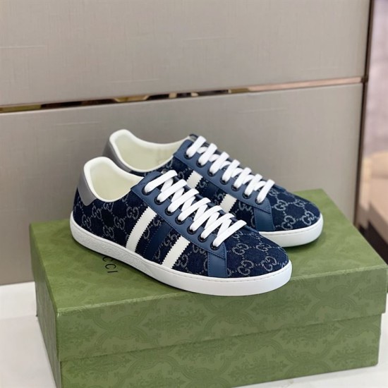 Gucci Men's GG Blue Denim Trainers Front Angle Front perspective of the Gucci Men's GG Blue Denim Low-Top Trainers on a green box