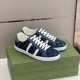 Gucci Men's GG Blue Denim Trainers Front Angle Front perspective of the Gucci Men's GG Blue Denim Low-Top Trainers on a green box