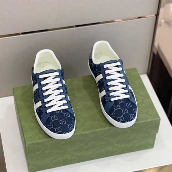 Gucci Men's GG Blue Denim Trainers Pair Top View Top-down pair view of Gucci Men's GG Blue Denim Low-Top Trainers sitting on a green box