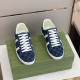 Gucci Men's GG Blue Denim Trainers Pair Top View Top-down pair view of Gucci Men's GG Blue Denim Low-Top Trainers sitting on a green box
