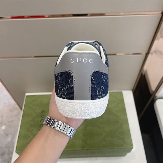 Gucci Men's GG Blue Denim Trainer Heel Tab View Rear view of the Gucci Men's GG Blue Denim Low-Top Trainer showing grey heel tab