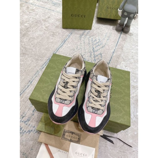 Gucci Rhyton Monogram Trainer Pair Overhead in beige and pink Direct top-down perspective showing laces and tongues of Gucci Rhyton trainers in beige and pink