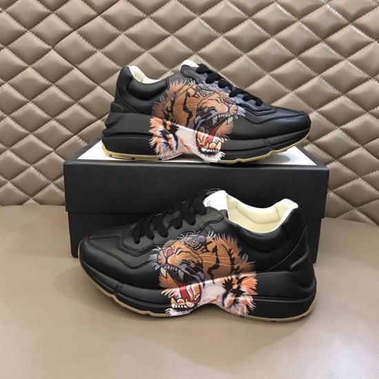 Gucci Rhyton Tiger Print Leather Trainers Pair Displayed in black Pair of Gucci Rhyton black leather tiger trainers displayed on shoe box