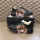 Gucci Rhyton Tiger Print Leather Trainers Pair Displayed in black Pair of Gucci Rhyton black leather tiger trainers displayed on shoe box