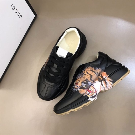 Gucci Rhyton Tiger Print Leather Trainers Overhead Angle in black Overhead angle showing a pair of Gucci Rhyton black leather tiger trainers