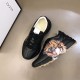 Gucci Rhyton Tiger Print Leather Trainers Overhead Angle in black Overhead angle showing a pair of Gucci Rhyton black leather tiger trainers