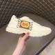 Gucci Rhyton Ivory Leather Trainer In Hand Hand holding Gucci Rhyton Ivory Leather Logo Print Trainer