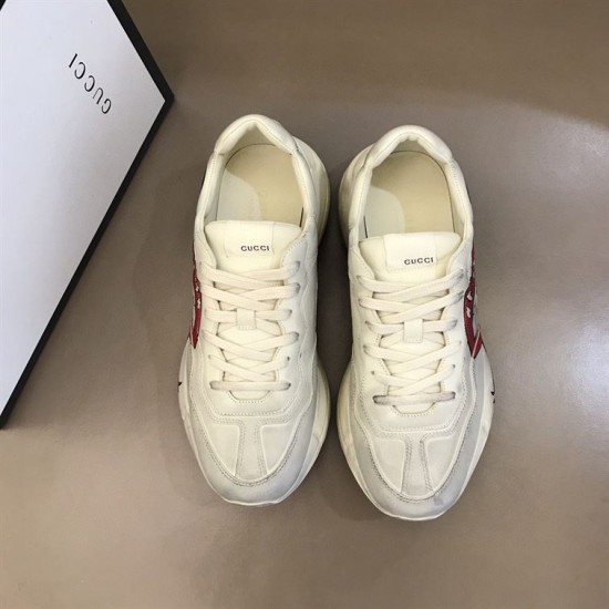 Gucci Mouth Print Trainers Overhead View in off white Top-down view of off white Gucci Rhyton trainers showing laces and tongue