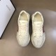 Gucci Mouth Print Trainers Overhead View in off white Top-down view of off white Gucci Rhyton trainers showing laces and tongue