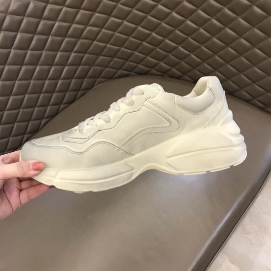 Gucci Rhyton Trainer Medial Side in off white Medial side profile of off white Gucci trainer showing clean paneled design