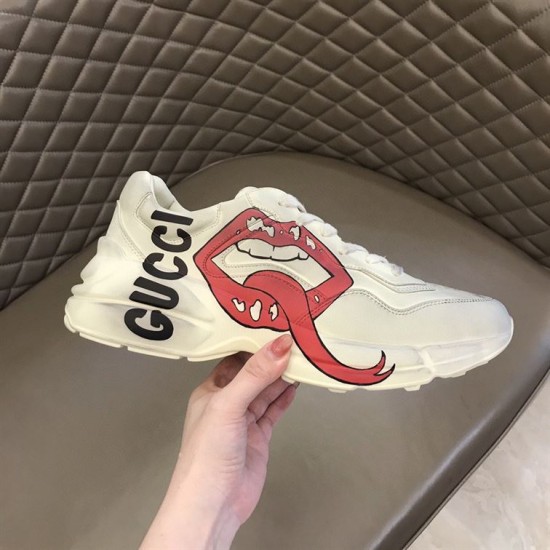 Gucci Rhyton Mouth Print Trainer In Hand in off white Off white Gucci mouth print trainer displayed in hand against neutral backdrop