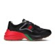 Gucci Rhyton Black Red Trainer Profile Profile shot of Gucci Rhyton black mesh and leather trainer on white background in black and red