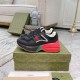 Gucci Rhyton Black Red Trainers Pair View Pair of Gucci Rhyton black red low top trainers resting on a green branded shoebox