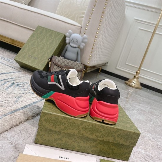 Gucci Rhyton Trainers Heel View in black and red Rear angle view of Gucci Rhyton trainers showcasing red heel counter and white collar lining in black and red