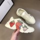 Gucci Rhyton Trainers Display View in ivory and red Pair of Gucci Rhyton trainers in ivory positioned next to shoe box in ivory and red