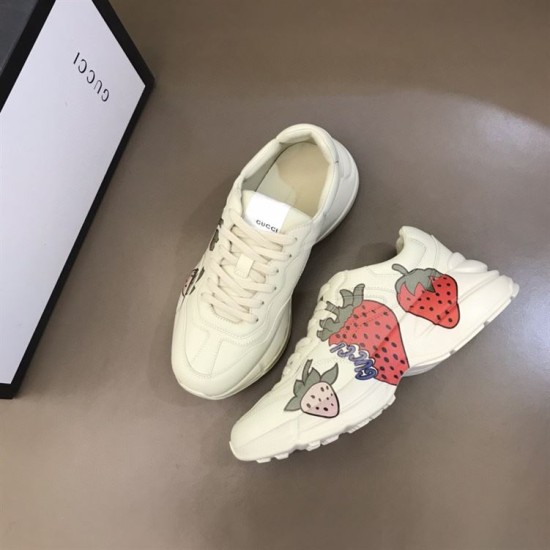 Gucci Rhyton Trainers Angled Pair View in ivory and red Angled view showing both inner and outer sides of Gucci Rhyton trainers in ivory and red