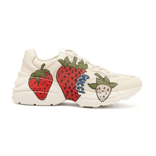 Gucci Rhyton Strawberry Trainers Side View in ivory and red Side profile of Gucci Rhyton ivory leather trainers with red strawberry print