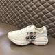 Lateral View of Gucci Rhyton Trainer on Bench in white Lateral profile view of Gucci Rhyton Trainer resting on bench in white