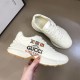 Gucci Rhyton Trainer Outer Printed Side Panel in white Gucci Rhyton Trainer held to show outer printed side panel in white