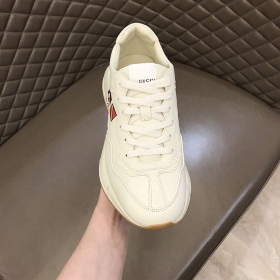 Top-Down View of Gucci Rhyton Worldwide Flag Printed White Leather Trainer Top-down front view of Gucci Rhyton Worldwide Flag Printed White Leather Trainer