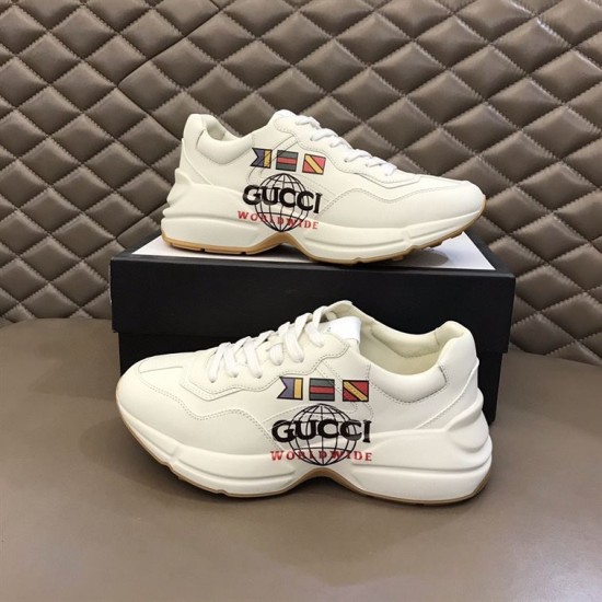 Pair of Gucci Rhyton Worldwide Flag Printed White Leather Trainers Pair of Gucci Rhyton Worldwide Flag Printed White Leather Trainers beside box