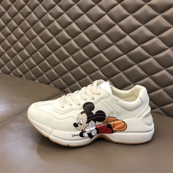 Gucci x Disney Rhyton Trainer Side Profile in ivory Side profile of Gucci x Disney Rhyton trainer showing character artwork in ivory