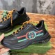 Gucci Black Leather Side-Stripe Trainers Handheld Side profile held view of Gucci Black Leather Interlocking G Side-Stripe Trainers