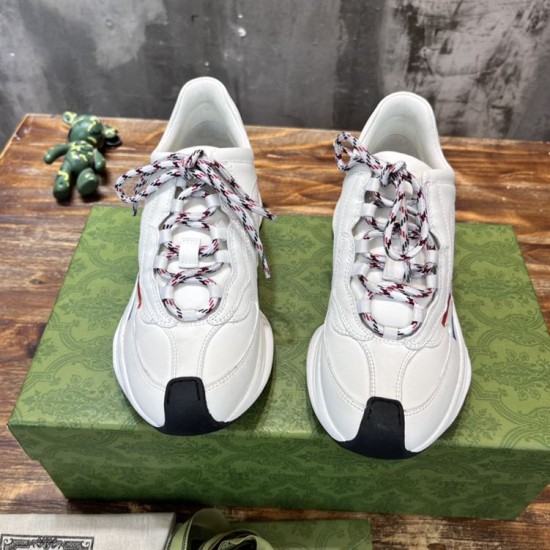 Gucci Run Leather Side-Stripe Trainers Off White pair front view highlighting laces and black toe wraps in off white and red