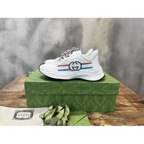 Gucci Run Leather Side-Stripe Trainers Off White resting on branded green shoebox in off white and red