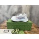 Gucci Run Leather Side-Stripe Trainers Off White resting on branded green shoebox in off white and red