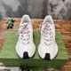Frontal view of white leather trainers with patterned laces