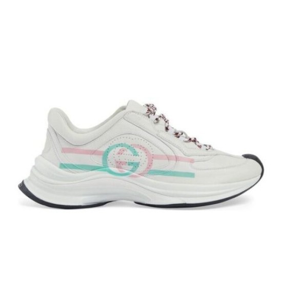 Side profile view of white leather runner trainer on white background
